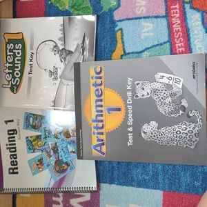 Abeka homeschool test keys for letter and sounds 1, reading 1, and arithmetic 1.